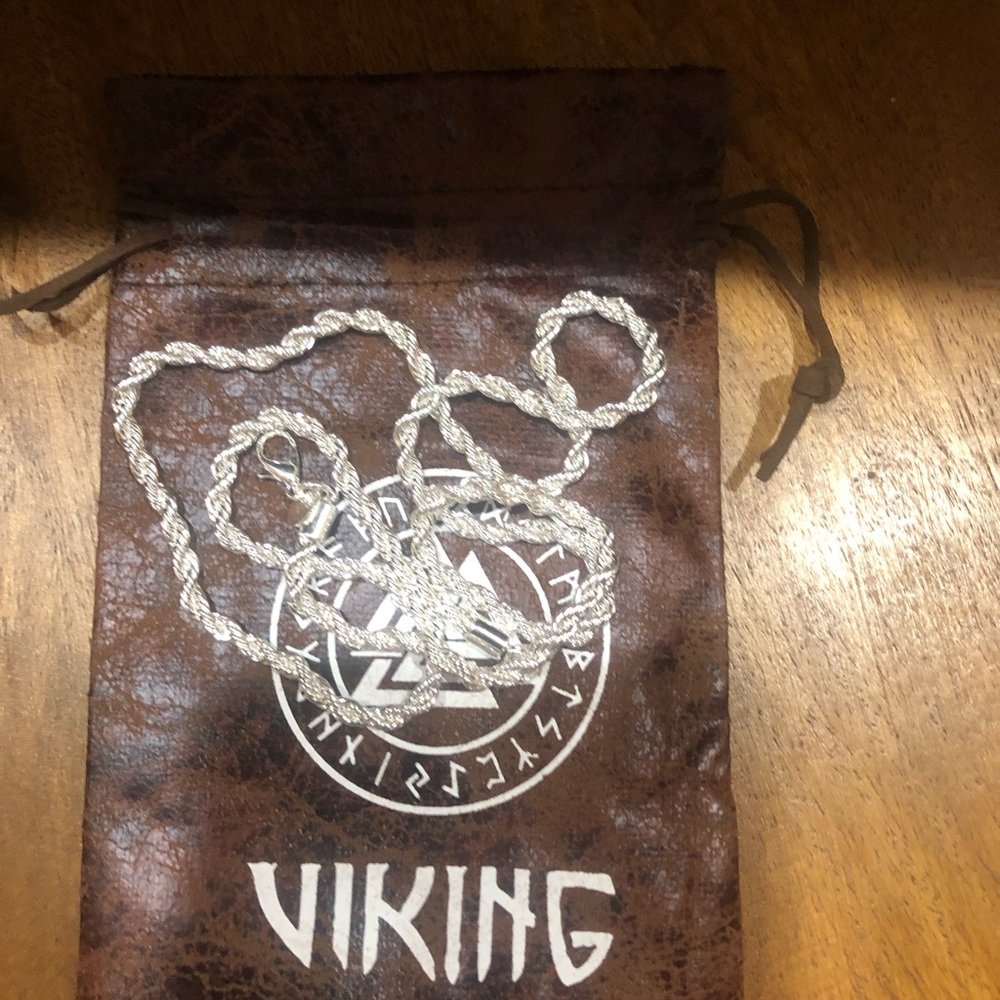 .925  4mm Silver chain that is. 55cm long with pouch